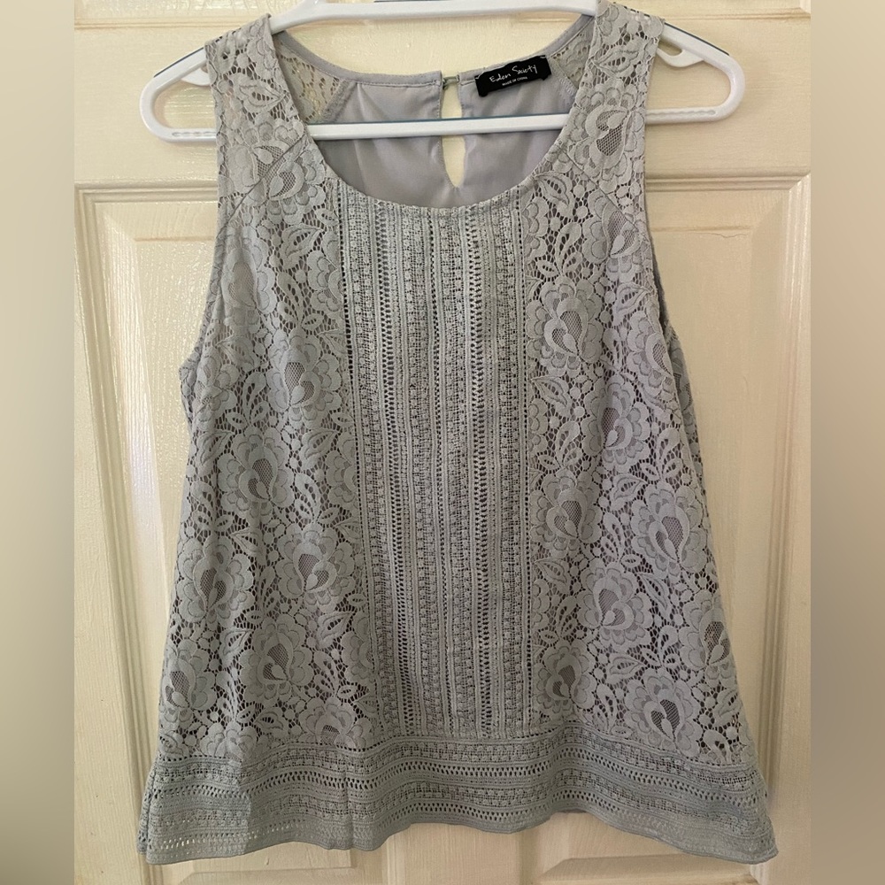 Eden Society sleeveless top. 70% cotton, 30% nylon. Machine wash, tumble dry.